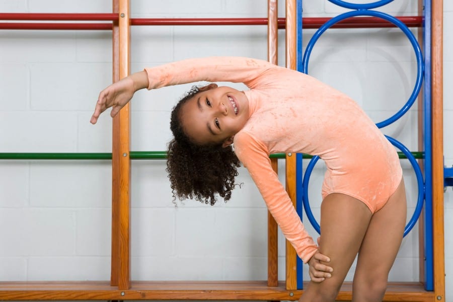 Girl in a red gymnastic leotard