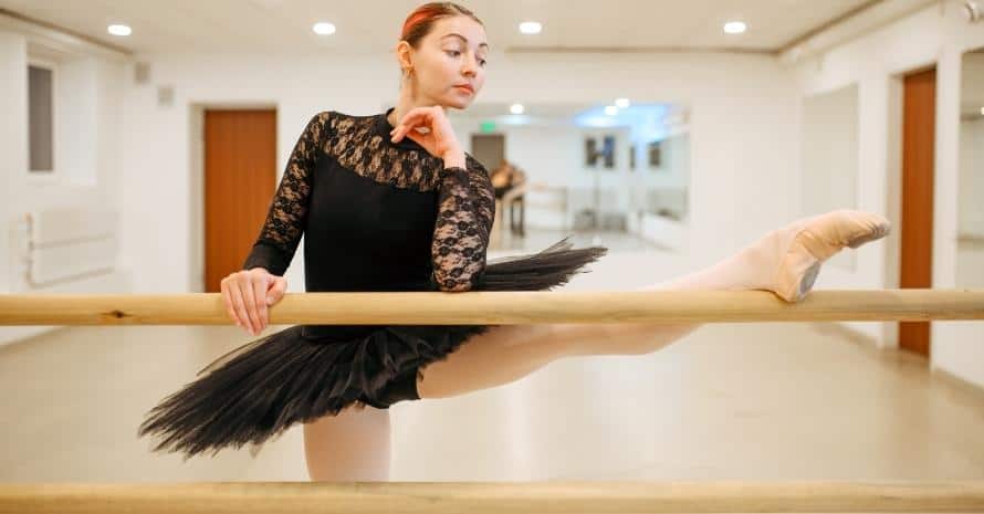 Choreographer poses on Ballet barre