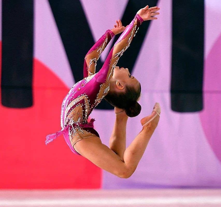 A girl in a gymnastic leotard