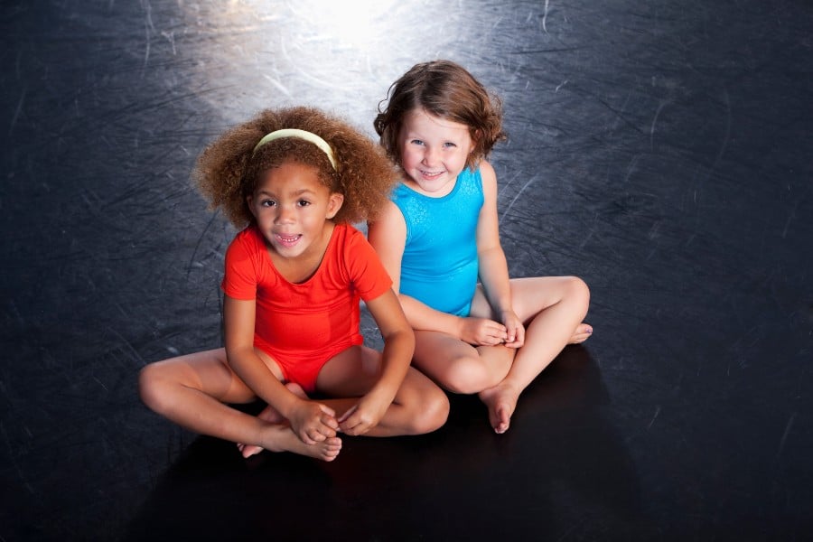 Two girls in toddler leotards