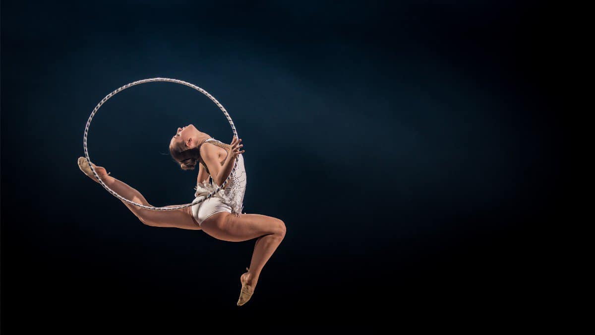 Gymnast does rhythmic gymnastics in a leotard